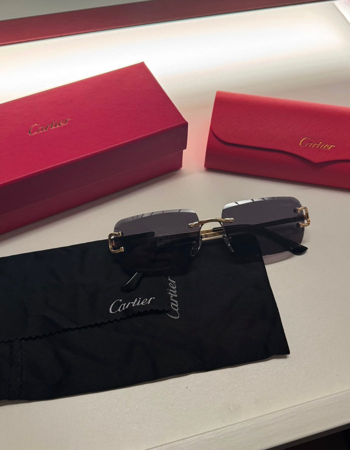 Rimless rectangular sunglasses on cloth with presentation box and case